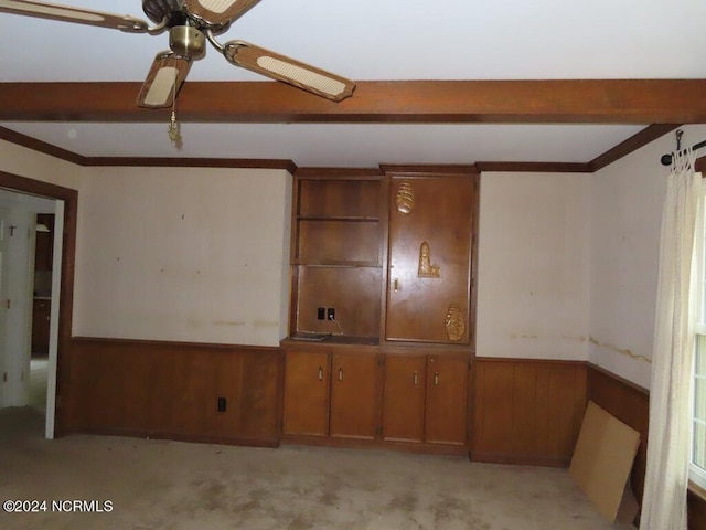 103 Creekview Ln, Washington, NC 27889 - spare room featuring a wainscoted wall, light colored carpet, a ceiling fan, wood walls, and beam ceiling