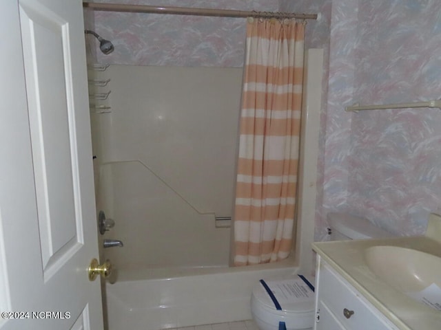 full bathroom featuring shower / tub combo, vanity, and toilet