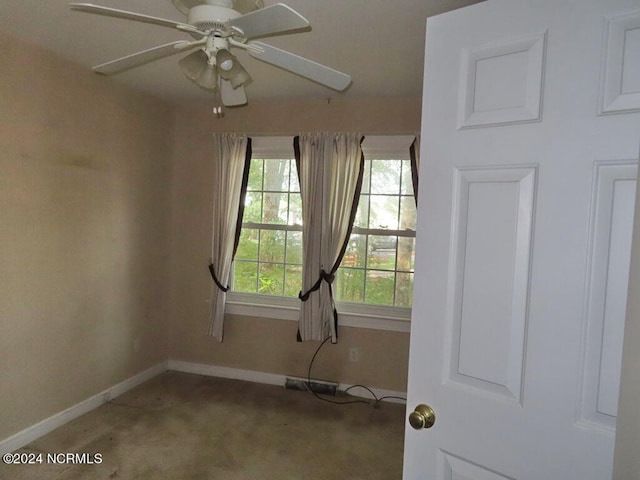 empty room featuring visible vents and a ceiling fan