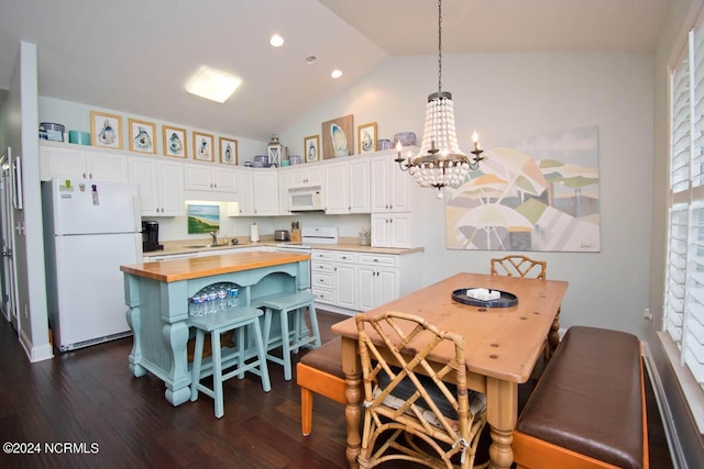 dining area featuring recessed lighting, dark wood-style flooring, a notable chandelier, and vaulted ceiling