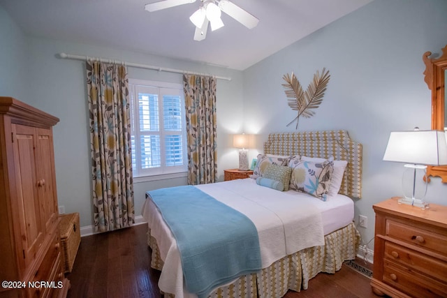 bedroom with ceiling fan and dark wood-type flooring