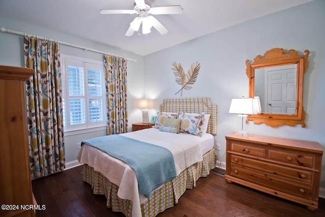 bedroom featuring ceiling fan and dark wood-type flooring