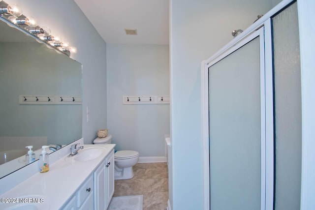 full bathroom featuring a stall shower, baseboards, visible vents, toilet, and a sink