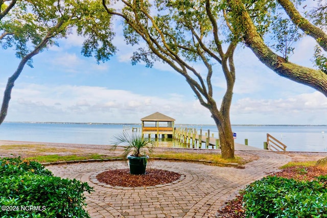 surrounding community with a water view