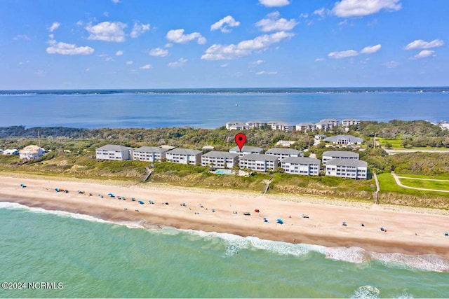 drone / aerial view with a water view and a view of the beach