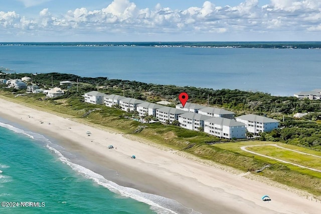 bird's eye view featuring a view of the beach and a water view