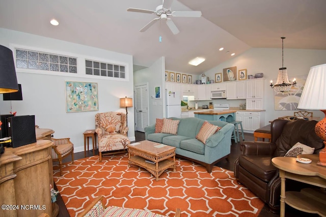 living area featuring lofted ceiling, ceiling fan with notable chandelier, wood finished floors, and recessed lighting