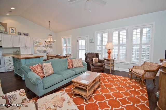 living room featuring dark wood finished floors, lofted ceiling, recessed lighting, baseboards, and ceiling fan with notable chandelier