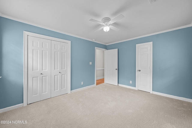 unfurnished bedroom with ceiling fan, light carpet, and crown molding