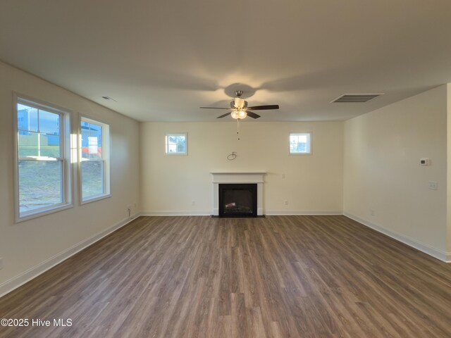 carpeted bedroom with ceiling fan, connected bathroom, and a tray ceiling