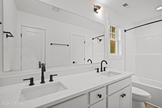 full bathroom featuring shower / tub combination, vanity, and toilet