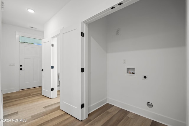 laundry area with hookup for a washing machine, hookup for an electric dryer, and hardwood / wood-style flooring