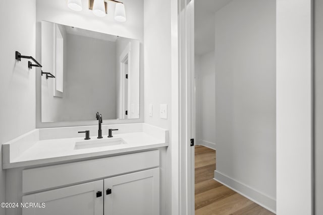 bathroom featuring vanity and hardwood / wood-style floors