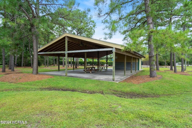 view of property's community with a lawn