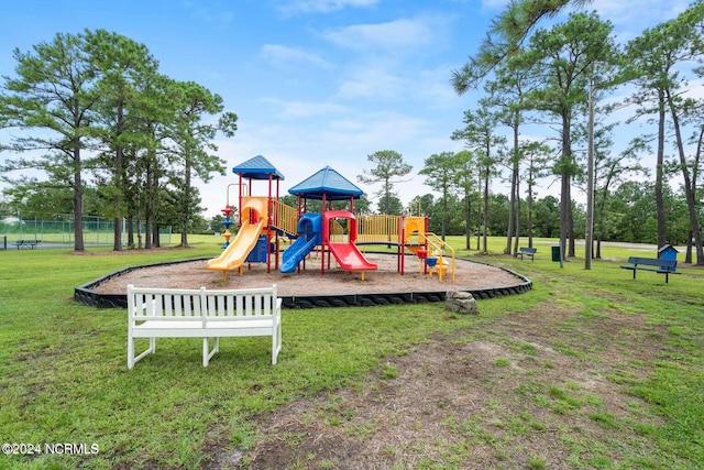 view of jungle gym with a lawn