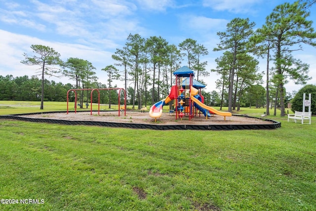 view of jungle gym featuring a lawn