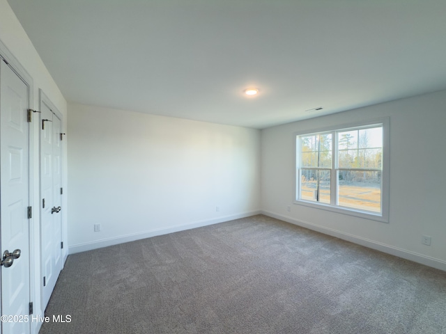 view of carpeted spare room