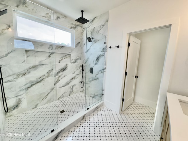 13 E Cannon Cv, Hampstead, NC 28443 - full bath with vanity, a marble finish shower, and baseboards