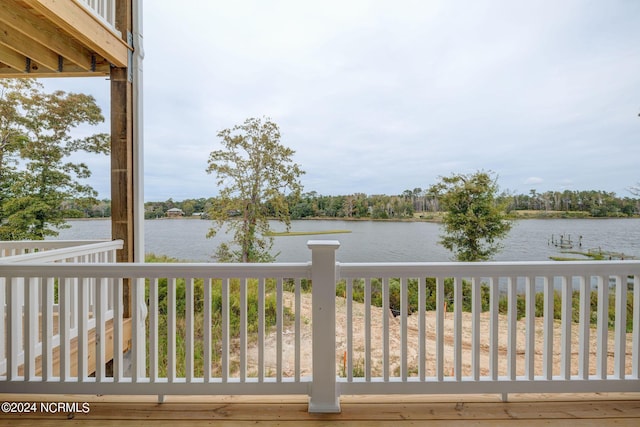 wooden deck with a water view