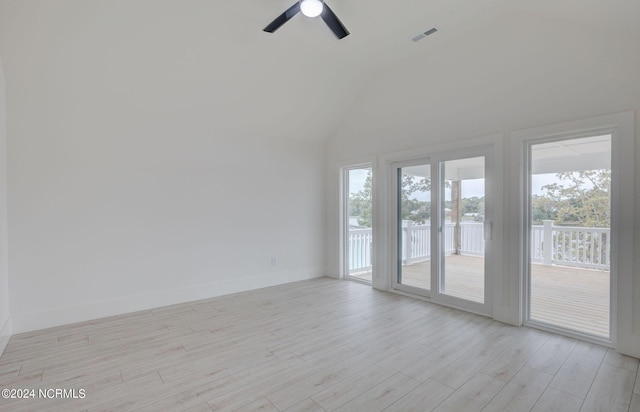 unfurnished room featuring light wood-type flooring, high vaulted ceiling, and ceiling fan