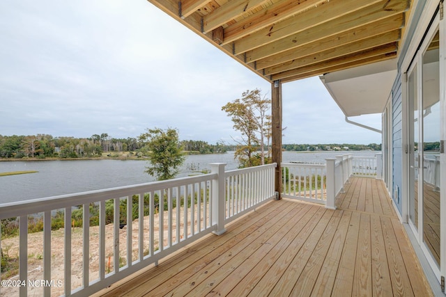 wooden deck with a water view