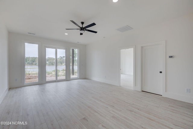 13 E Cannon Cv, Hampstead, NC 28443 - unfurnished room with a ceiling fan, baseboards, visible vents, and light wood-style flooring
