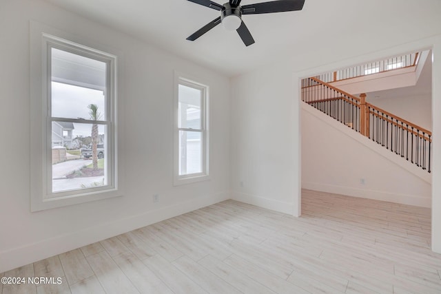 13 E Cannon Cv, Hampstead, NC 28443 - unfurnished room with a ceiling fan, baseboards, visible vents, and light wood-style flooring