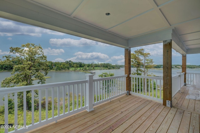 wooden terrace with a water view