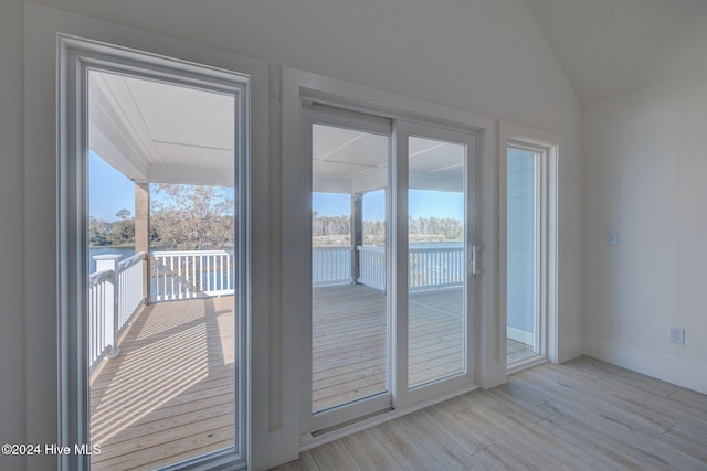 13 E Cannon Cv, Hampstead, NC 28443 - doorway to outside with light wood-type flooring, baseboards, a water view, and visible vents