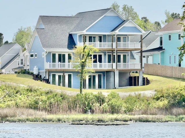 13 E Cannon Cv, Hampstead, NC 28443 - back of property with a balcony, a water view, and roof with shingles
