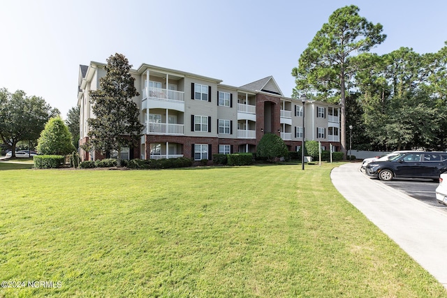 view of property featuring uncovered parking