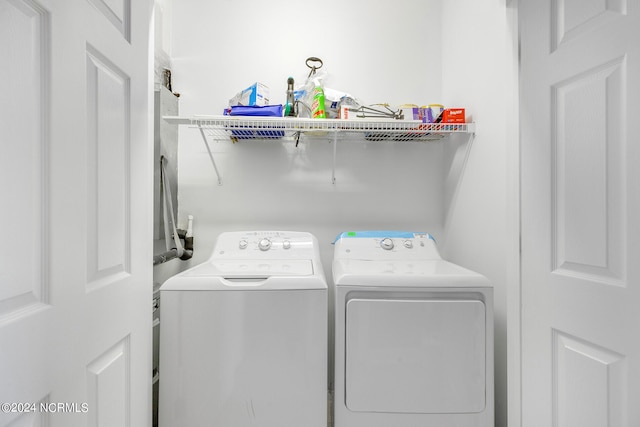 laundry room featuring washer and clothes dryer