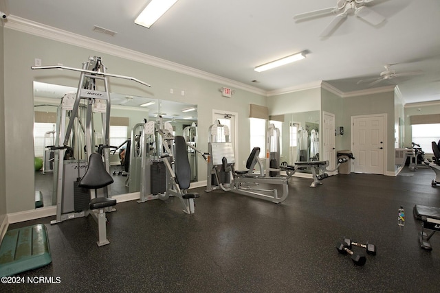 gym featuring ceiling fan, ornamental molding, and baseboards