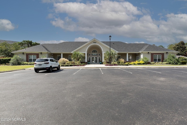 view of property featuring uncovered parking