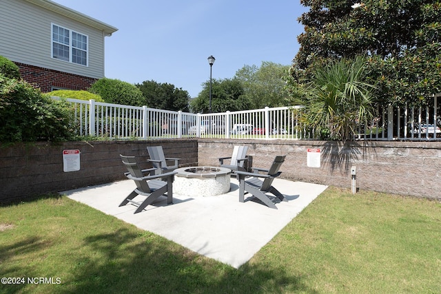 view of patio featuring a fire pit and a fenced backyard