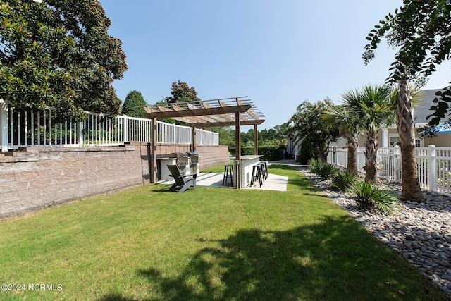 view of yard with a pergola and a patio