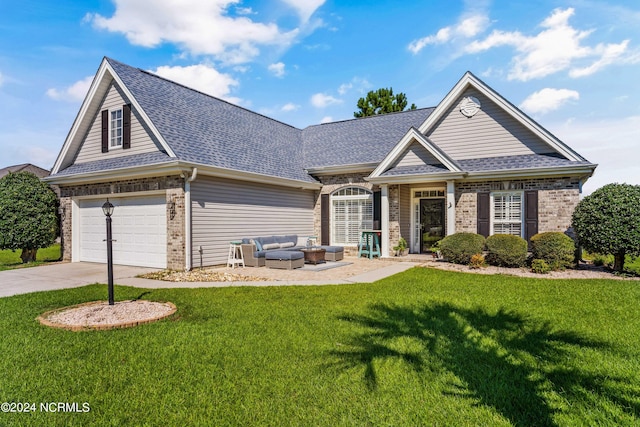 view of front of home with a front lawn, an outdoor hangout area, and a garage