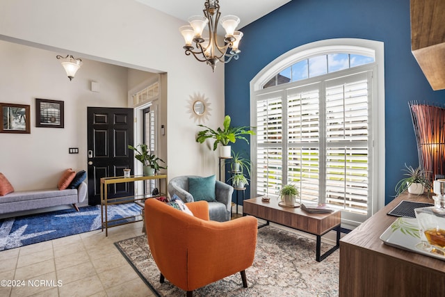 sitting room with light tile patterned flooring and a chandelier