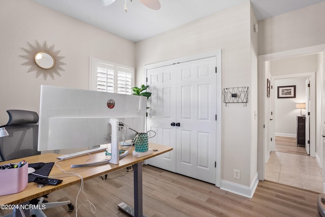 office area with ceiling fan and light hardwood / wood-style flooring