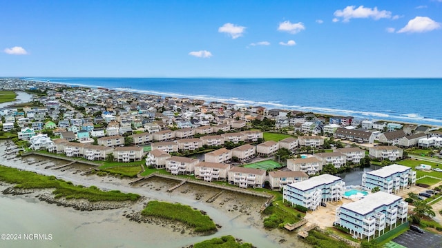 aerial view with a water view and a beach view