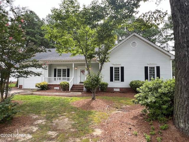 view of front facade with a garage and covered porch