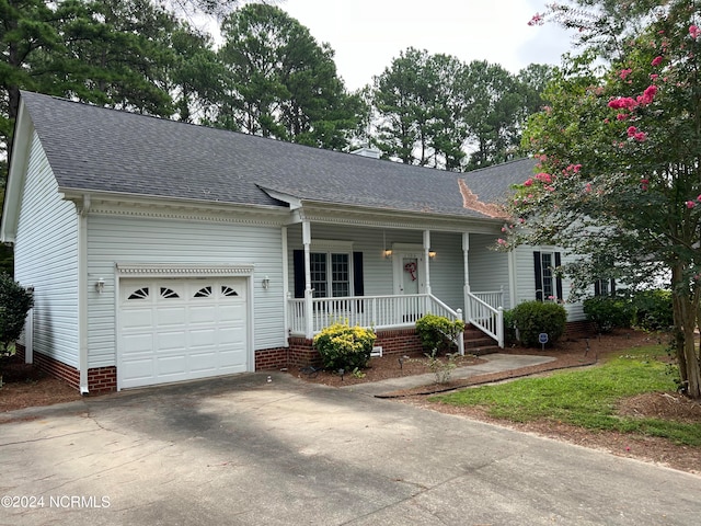 view of front facade featuring a garage and a porch