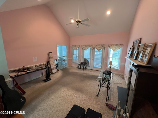 workout room with high vaulted ceiling, ceiling fan, and carpet floors