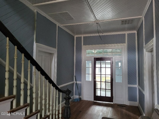 entrance foyer featuring hardwood / wood-style flooring and crown molding