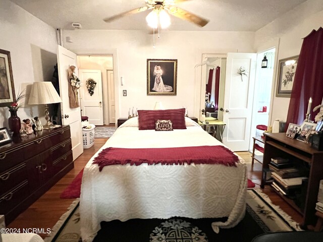 bedroom featuring dark hardwood / wood-style floors and ceiling fan