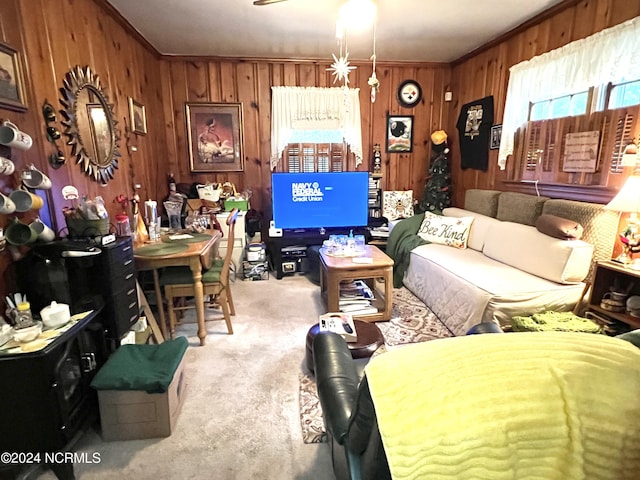 carpeted living room with ornamental molding and wooden walls