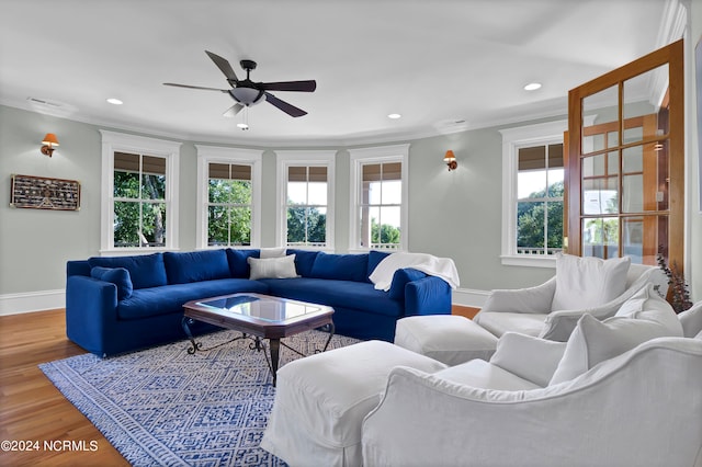 living room with ceiling fan, crown molding, hardwood / wood-style flooring, and a healthy amount of sunlight