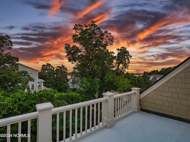 view of balcony at dusk