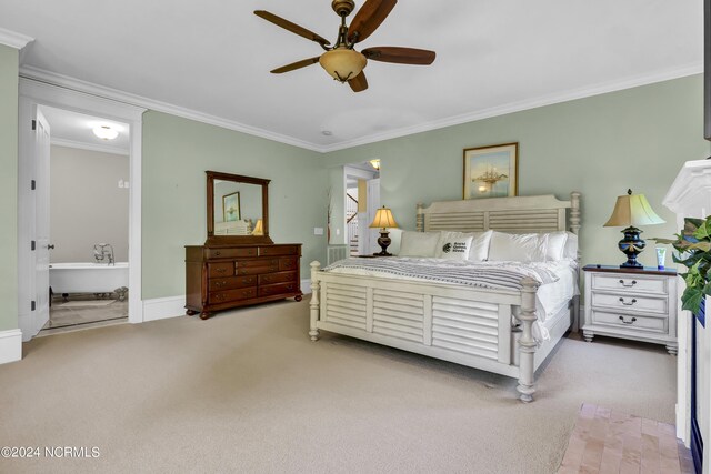 bedroom featuring ceiling fan, crown molding, light carpet, and connected bathroom