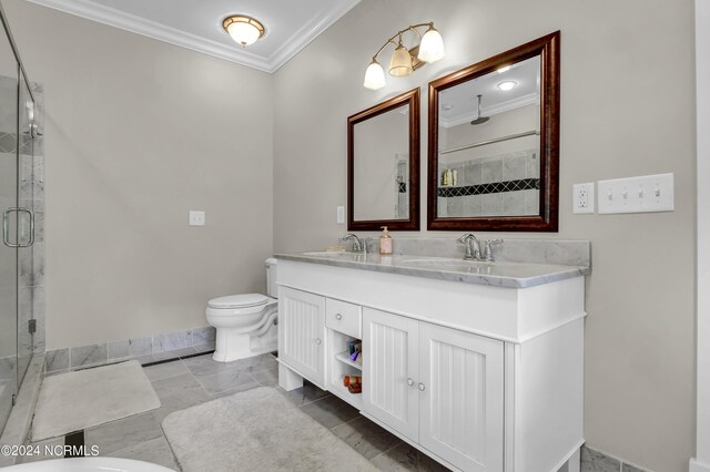 bathroom with dual vanity, tile patterned floors, toilet, and crown molding